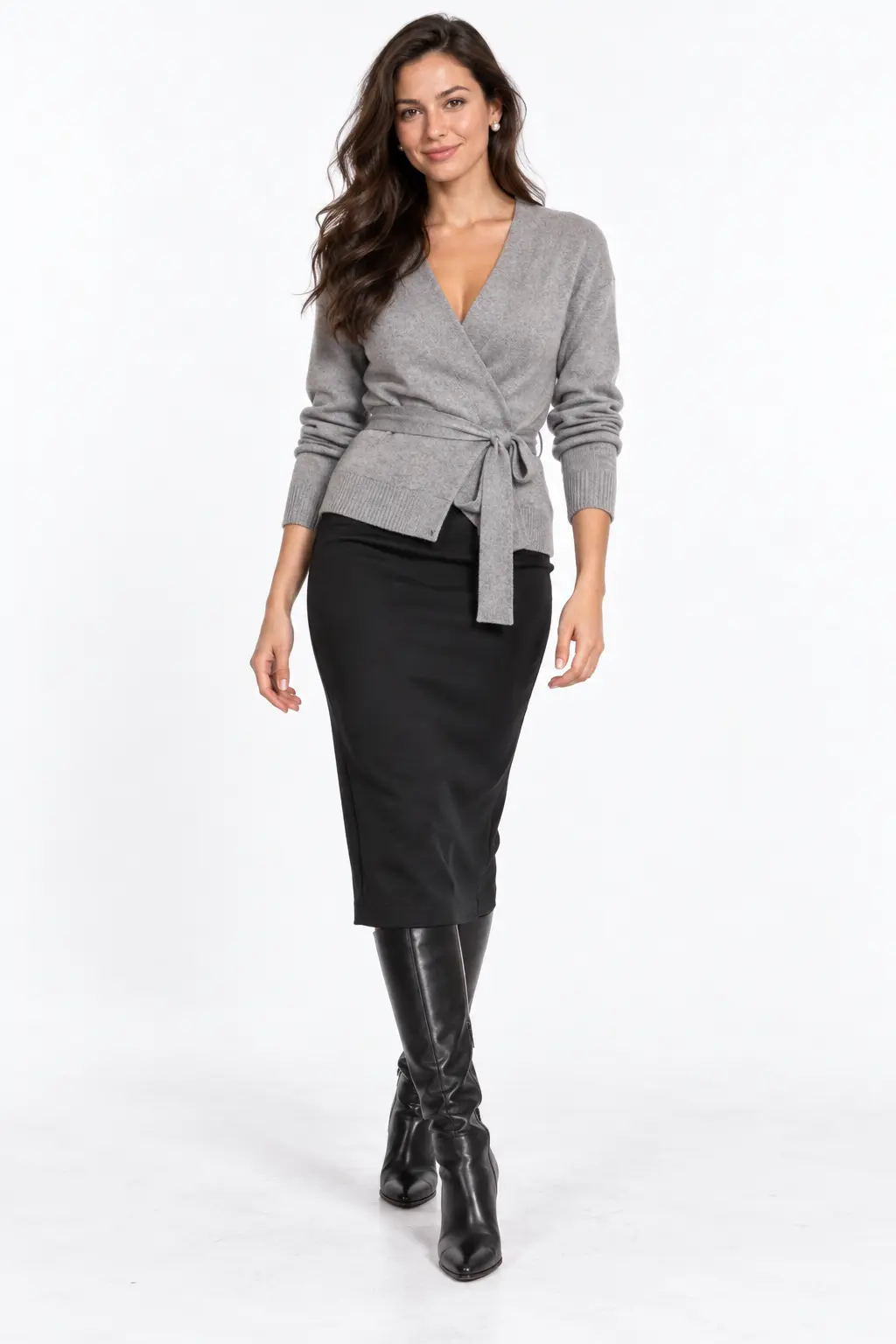 Grey Wrap Cardigan and Pencil Skirt Full-body white-studio image of a woman wearing grey wrap cardigan; black pencil midi skirt; knee-high boots; pearl studs.