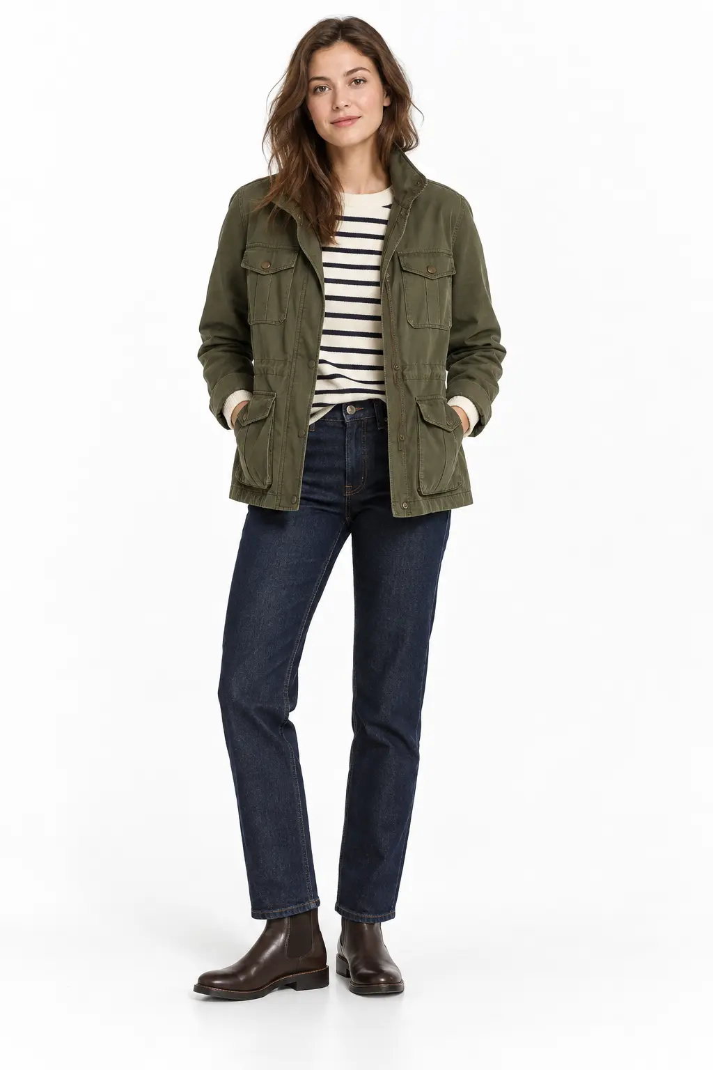 Olive Field Jacket with Breton Knit Full-body white-studio image of a woman wearing olive field jacket; cream and navy Breton knit; dark indigo jeans; brown Chelsea boots.