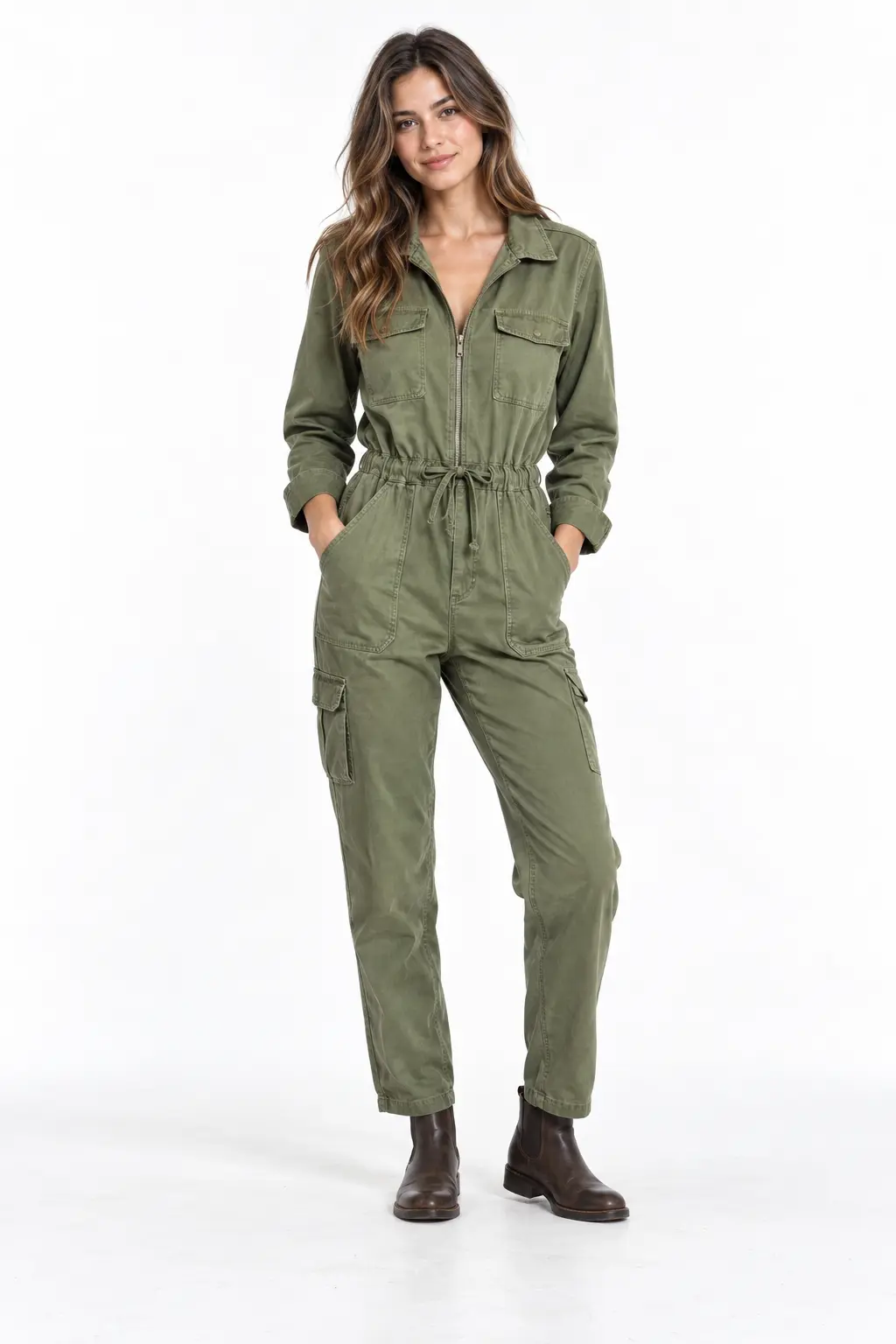 Sage Utility Jumpsuit Full-body white-studio image of a woman wearing sage utility jumpsuit; brown flat boots.