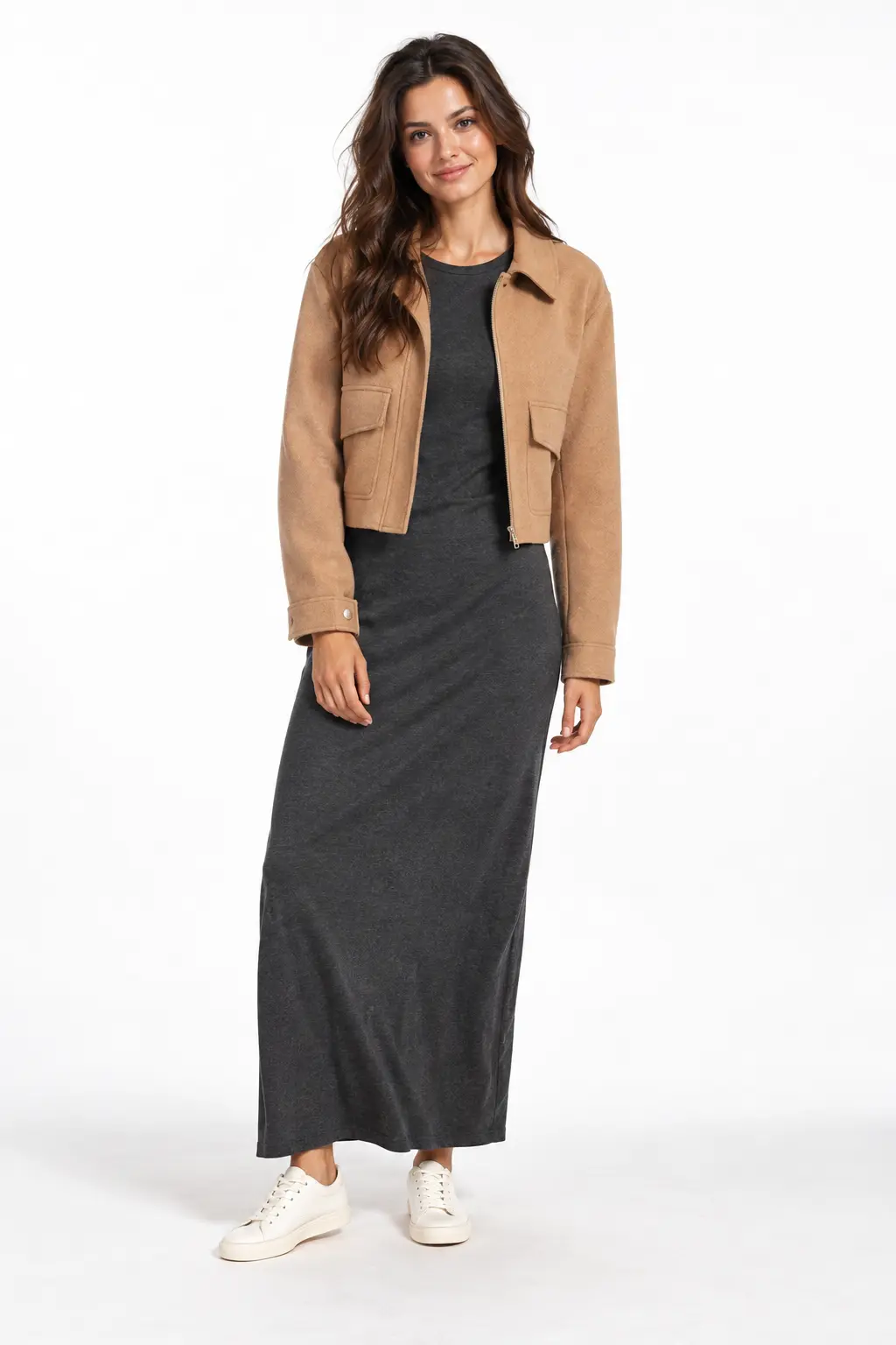 Jersey Maxi Dress and Cropped Jacket Full-body white-studio image of a woman wearing charcoal jersey maxi dress; cropped camel jacket; white sneakers.