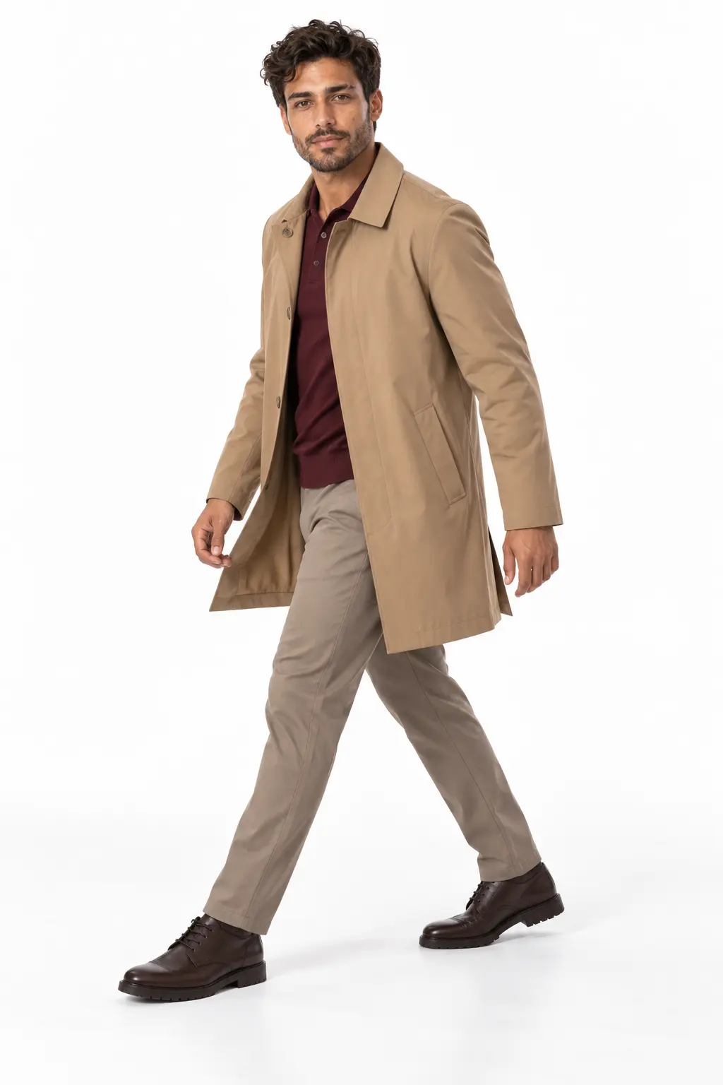 Men's Camel Car Coat Rain Outfit A man walking while wearing a camel-colored car coat, maroon polo shirt, khaki trousers, and dark brown dress shoes.